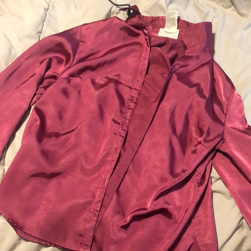 It’s a pink Satin Dressy button up shirt perfect to wear on date nights